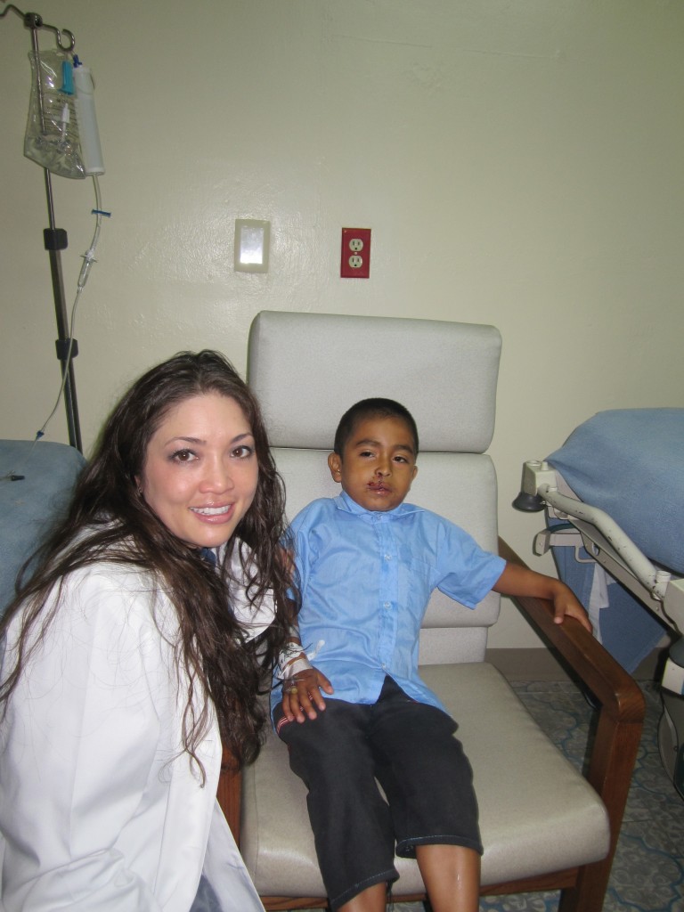 Sato photo with a patient in Guatemala